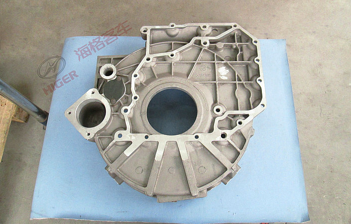 Flywheel housing manufacturing assembly