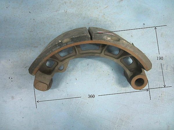 Lower brake shoe with friction plate and roller assembly