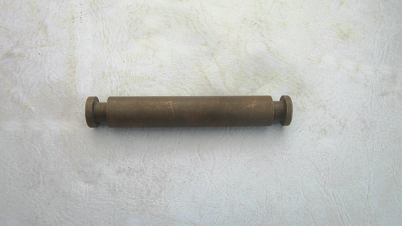 Return spring fixing pin