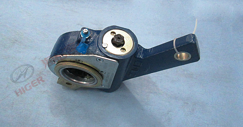 Rear brake adjustment arm assembly