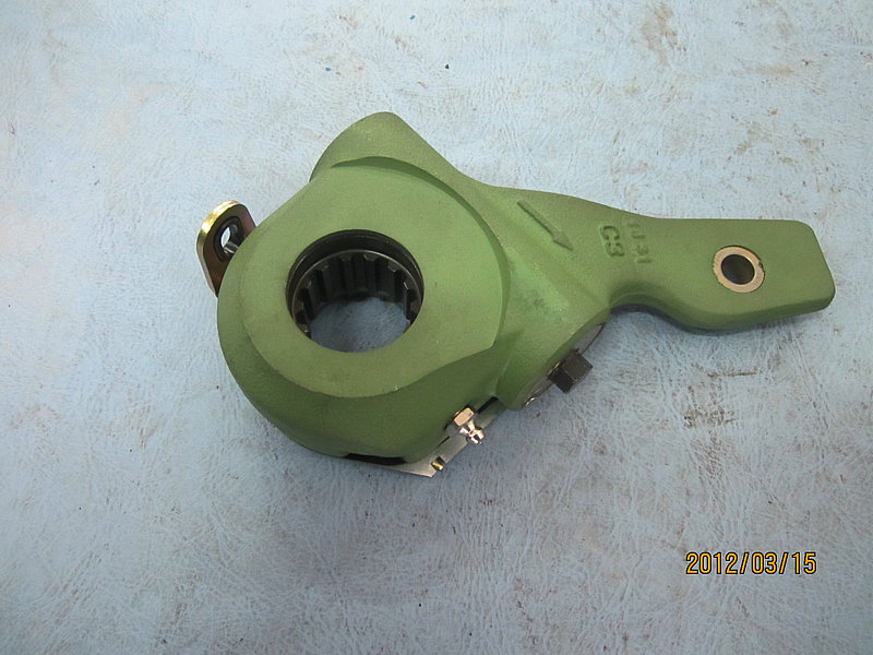 Rear brake adjustment arm assembly