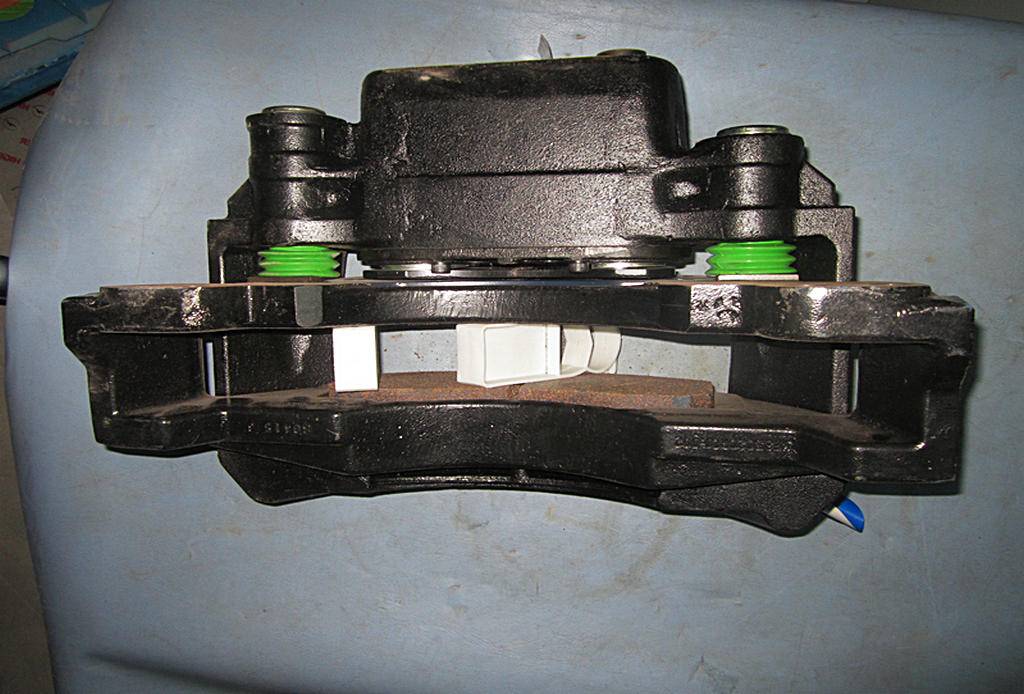 Left brake caliper assembly