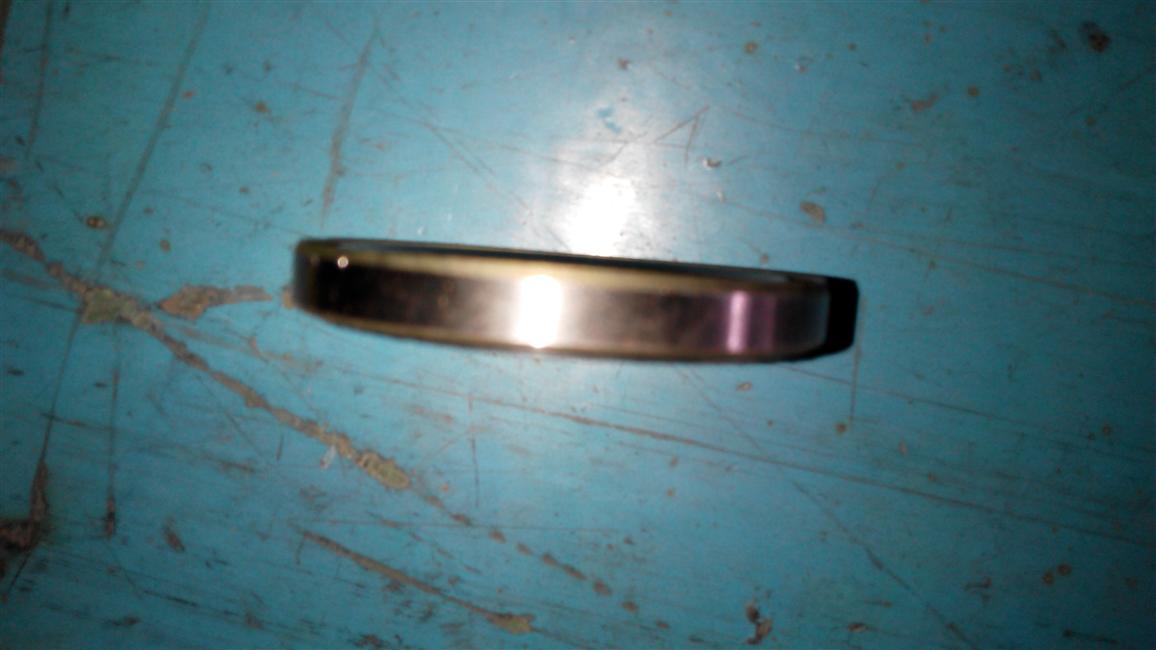 Oil seal assembly-rear brake base plate, 24NS19N-00005