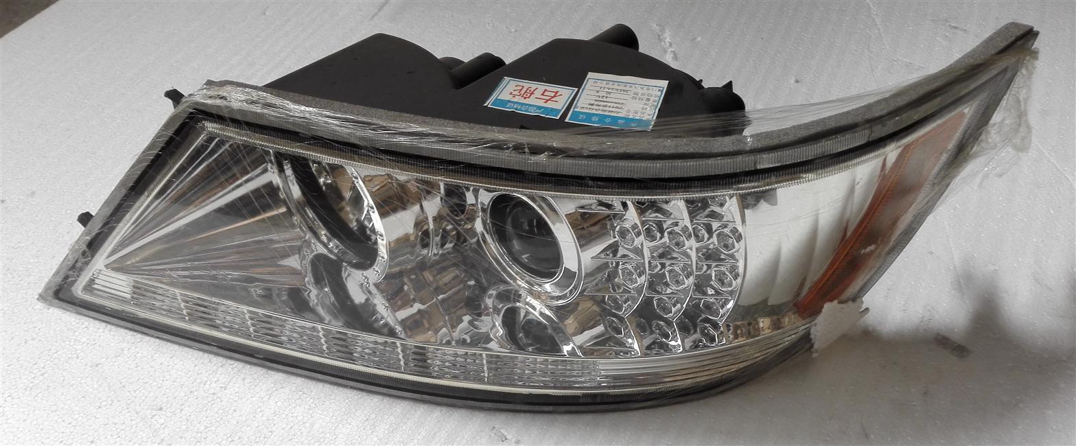 Left front combination light assembly, right rudder, 11 models, Emark certified, KS