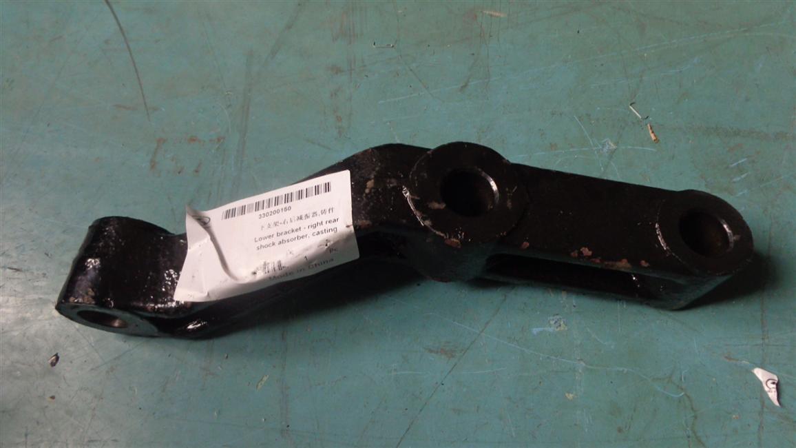 Lower bracket-right rear shock absorber, casting