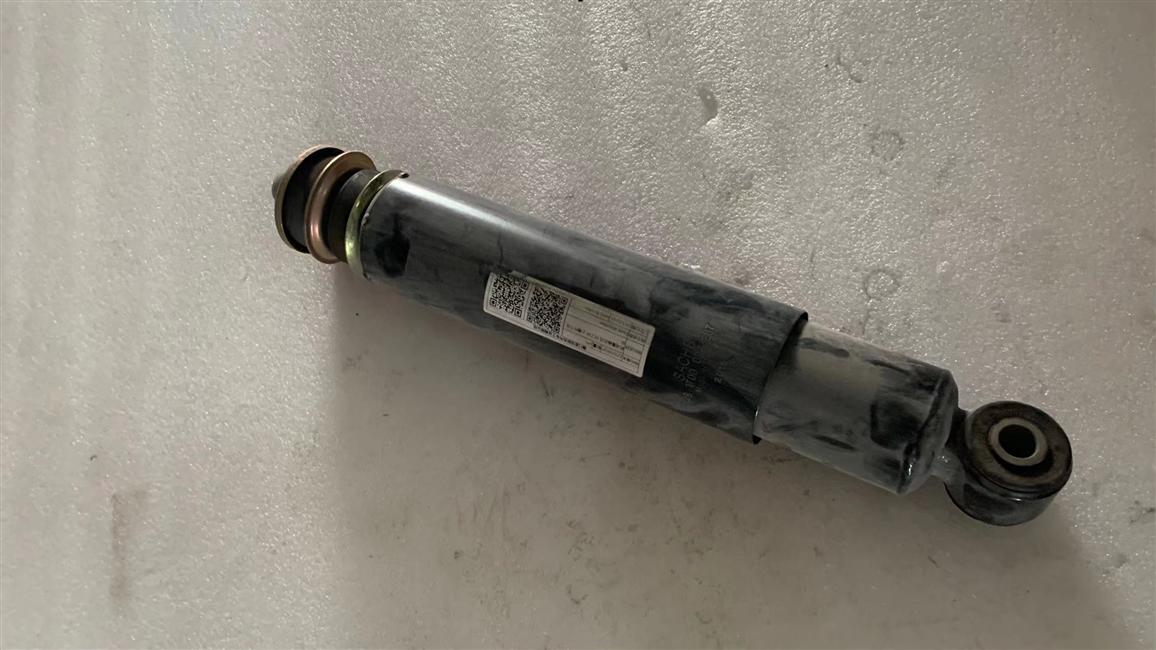 Front shock absorber assembly, 50, 230, upper screw lower hoisting ring