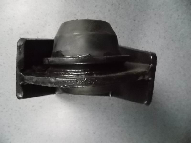 D The right rubber pad in front of the engine-1