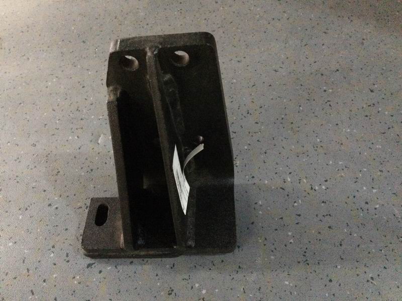 The upper left bracket is placed on the rear of the engine