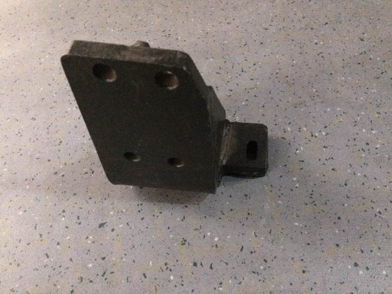 The upper left bracket is placed on the rear of the engine-1