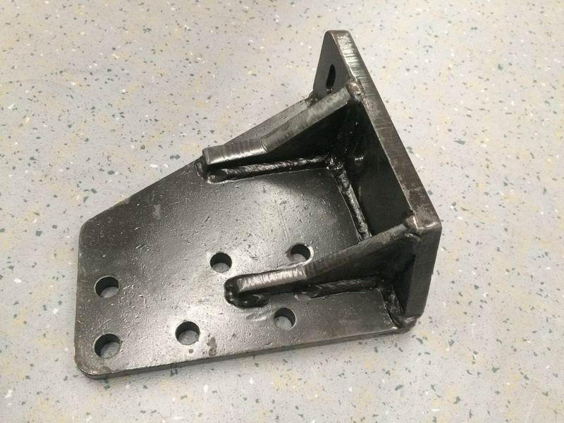 The upper right bracket is suspended in the rear of the engine