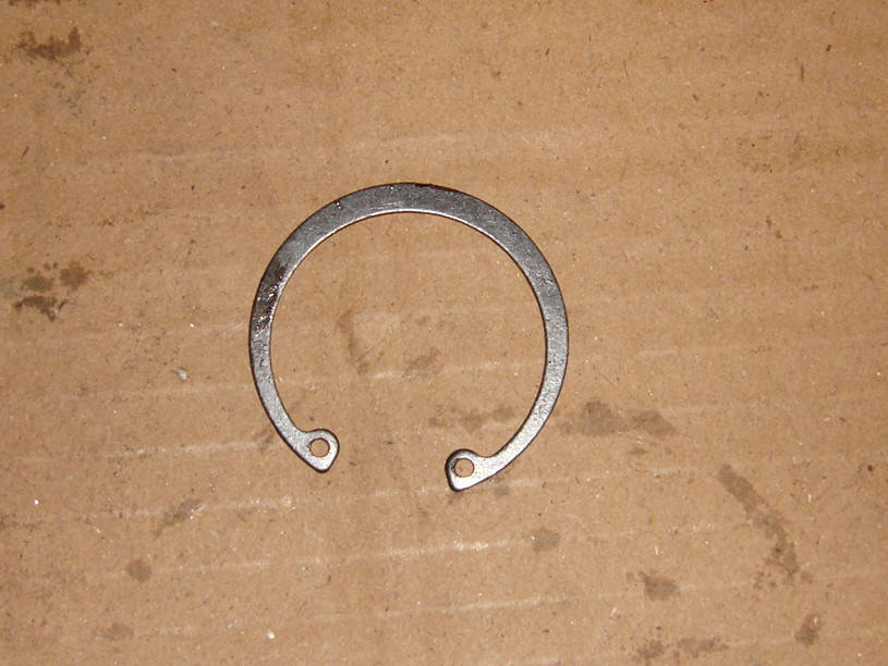 Elastic retaining ring for holes-piston pin