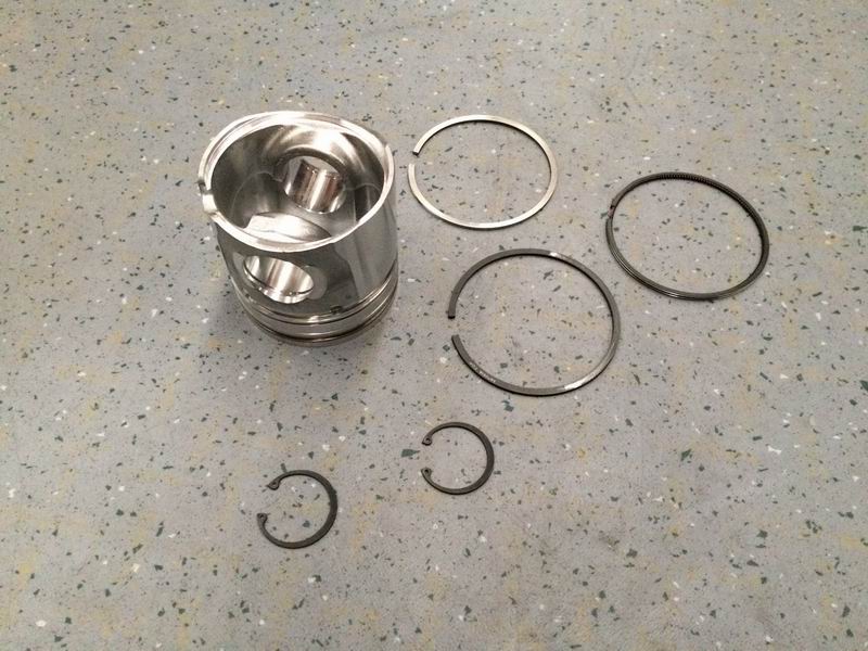 Piston/piston ring/piston pin spring assembly
