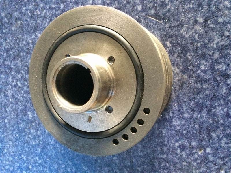 Crankshaft belt shock absorber