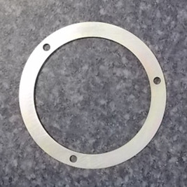 Camshaft gear timing signal disc baffle