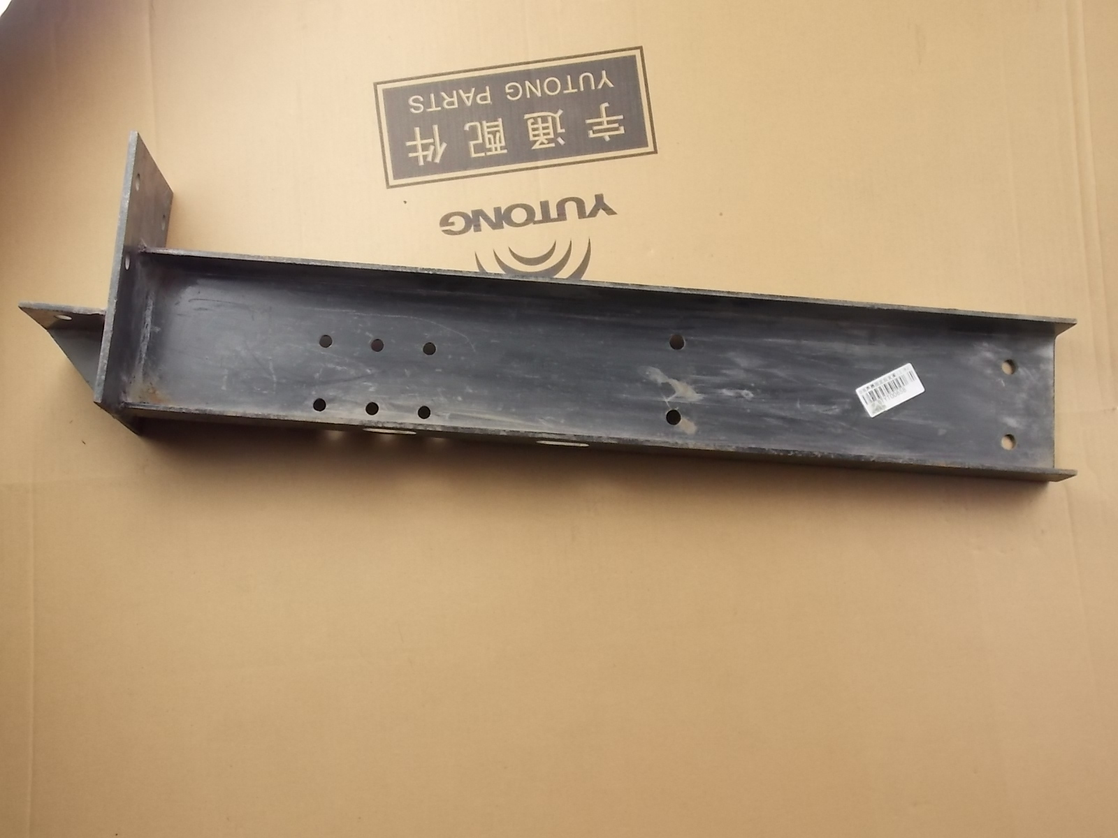 D The muffler fixes the rear support beam (process 20); without Qi-2