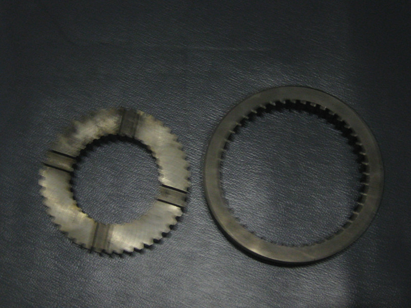 Reverse sliding gear sleeve and seat assembly