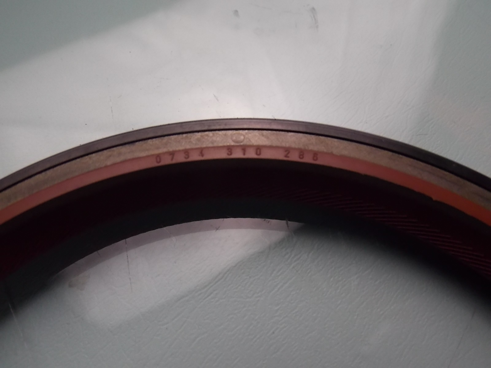 Two-axis oil seal