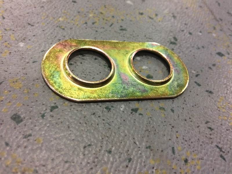 Shaft end lock plate