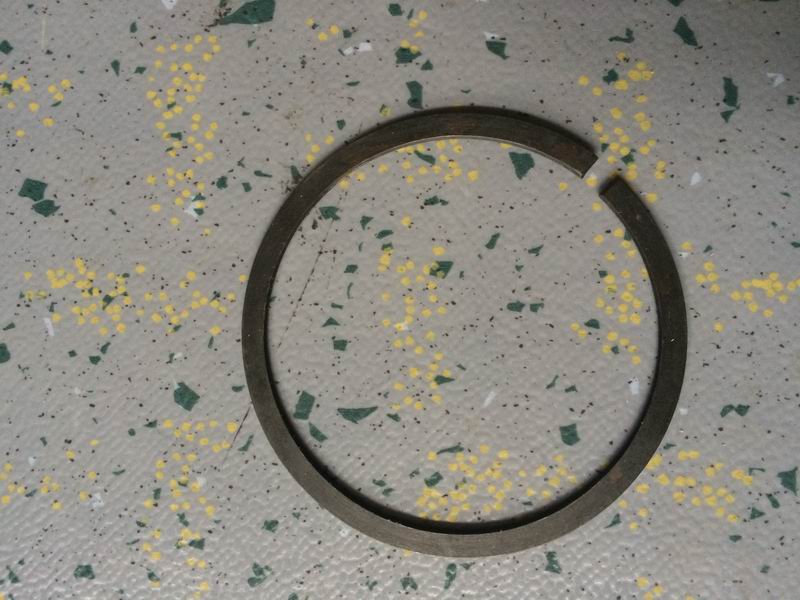 Two-axle rear bearing stop ring