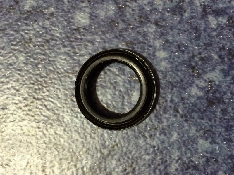 Shift shaft oil seal assembly