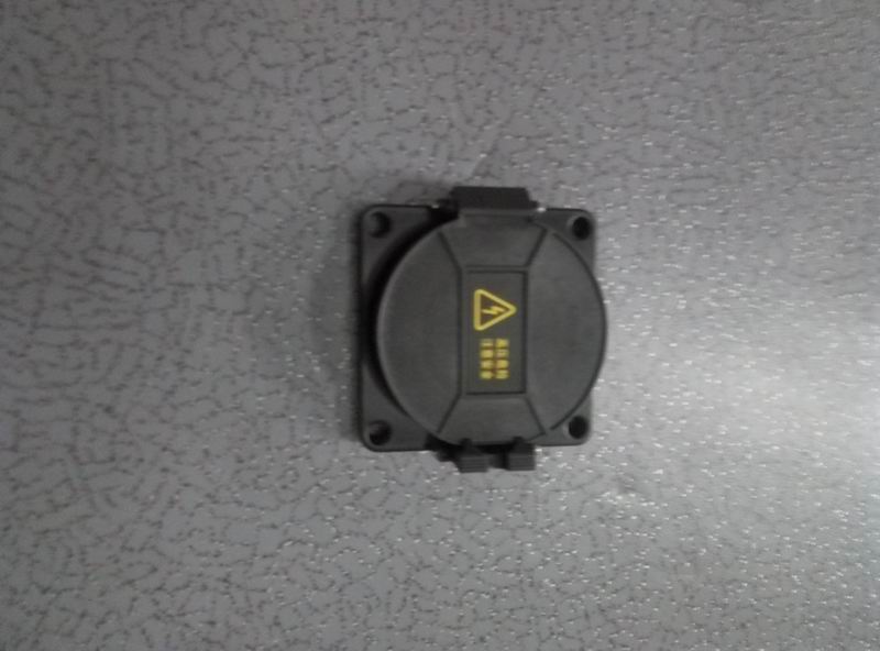 DC charging socket cover; contains spring