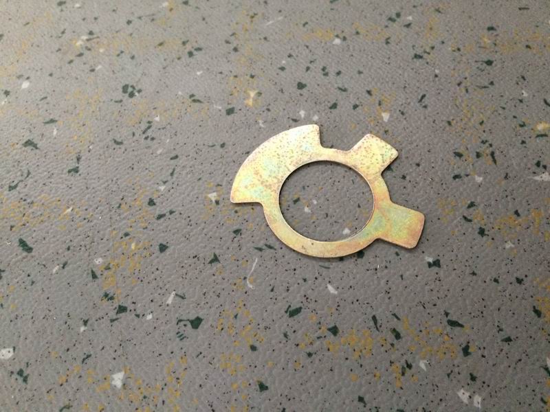 Lock plate-support stud fastening nut