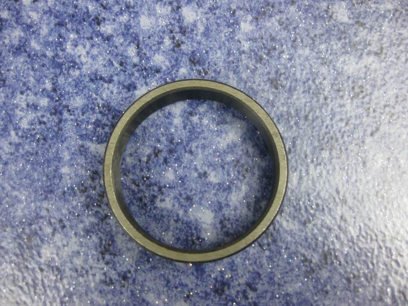 Spacer-active bevel gear front bearing; contains 3 pieces