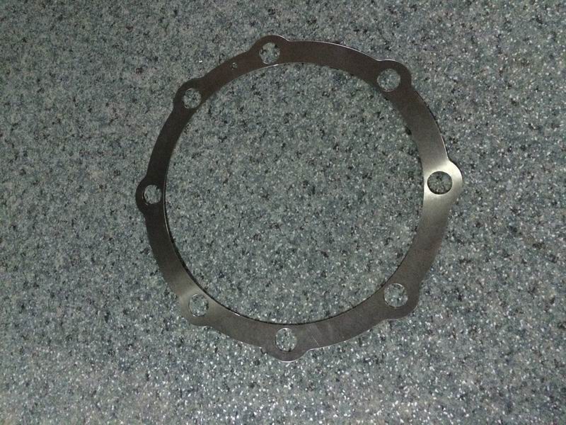 Bearing seat adjustment gasket