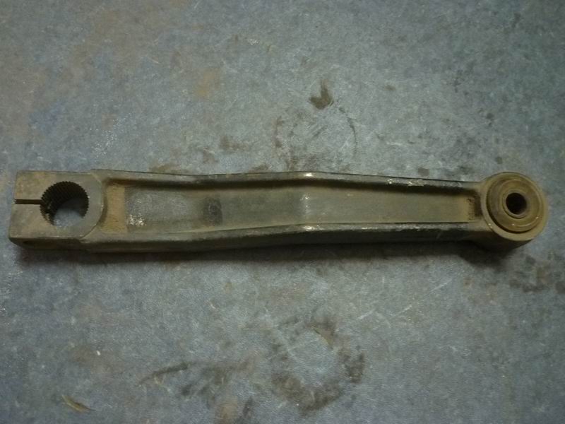 Swing arm and bushing assembly