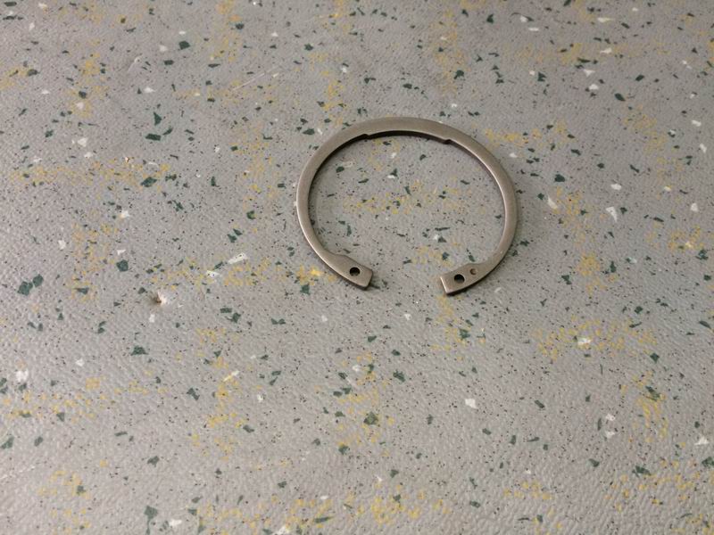 Elastic retaining ring for holes