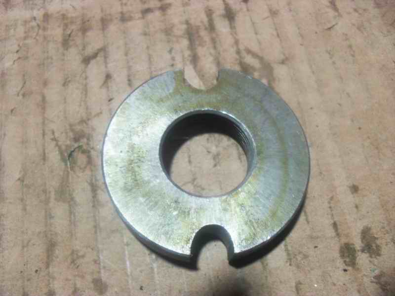 Front axle adjustment nut