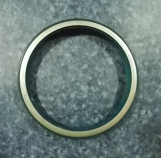 Rear wheel external oil seal-left
