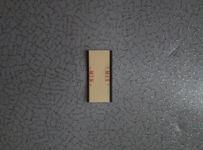 Steering tank oil level sign