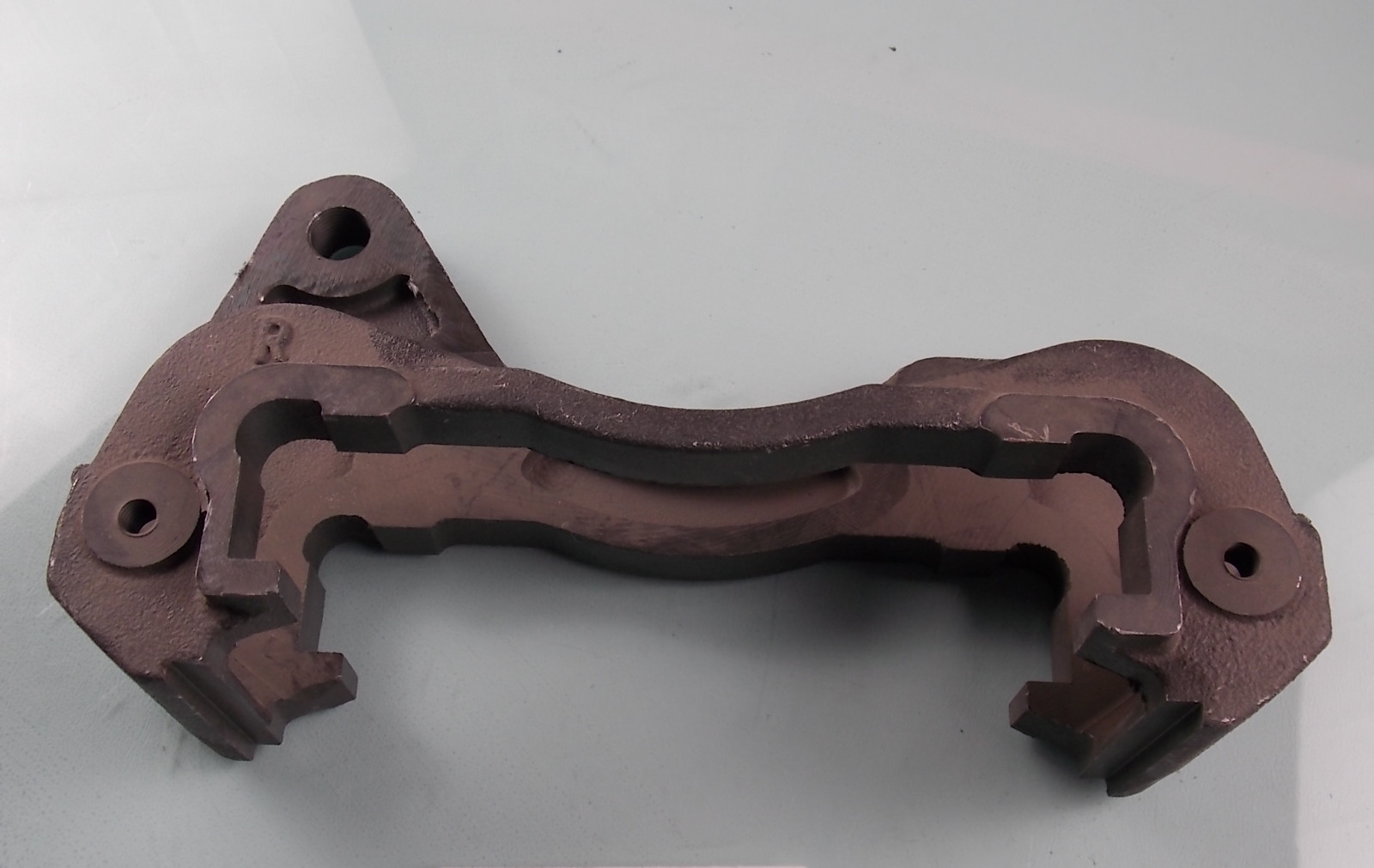 Caliper bracket-left