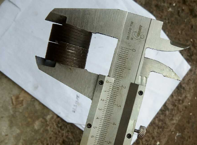 Return spring; for clearance adjustment mechanism