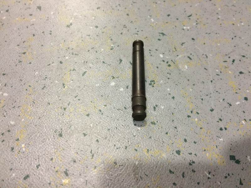 Brake spring fixing pin