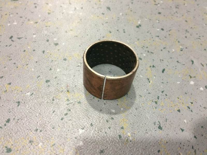 Camshaft bracket bushing