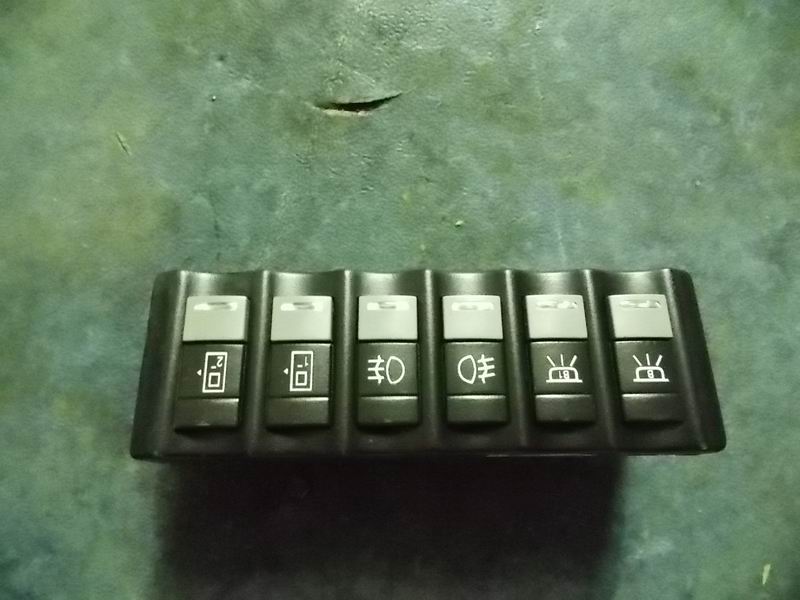 CAN switch module; center row on the right side of the instrument cluster