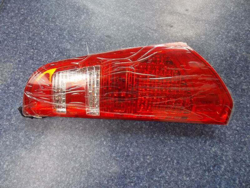 Combined rear taillight-left; no decorative panel included