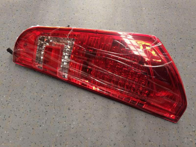 Combined rear taillight assembly; left; no decorative panel