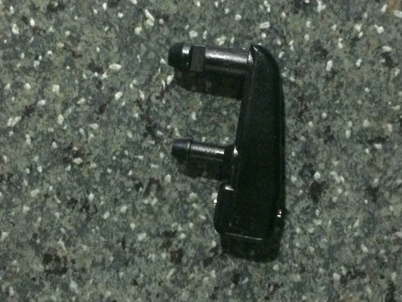 Wiper arm spray nozzle-left