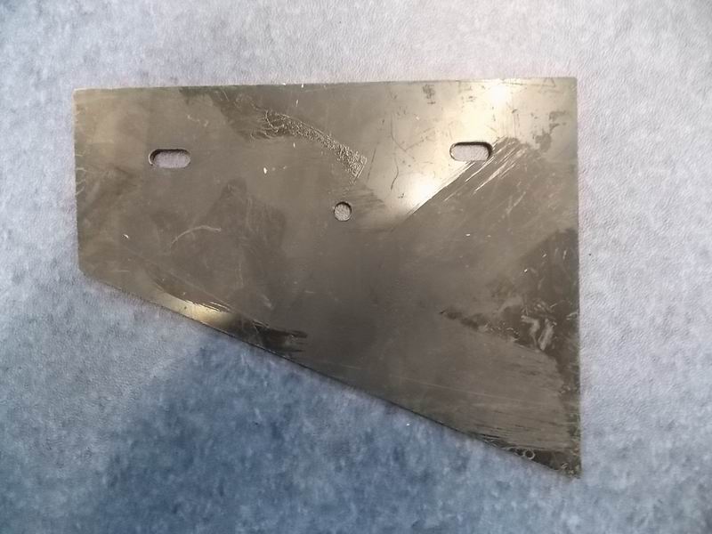 Hinge shim on the left side of the engine hatch door