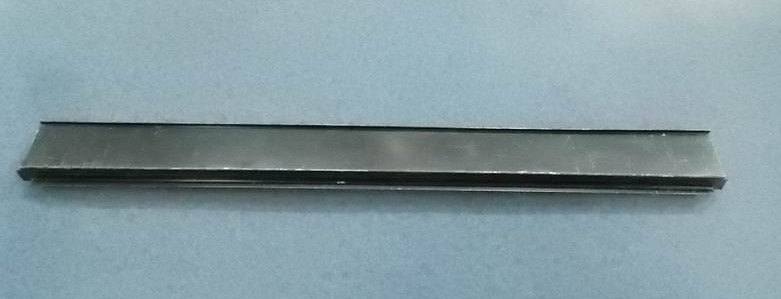 The upper end of the third hatch door on the left