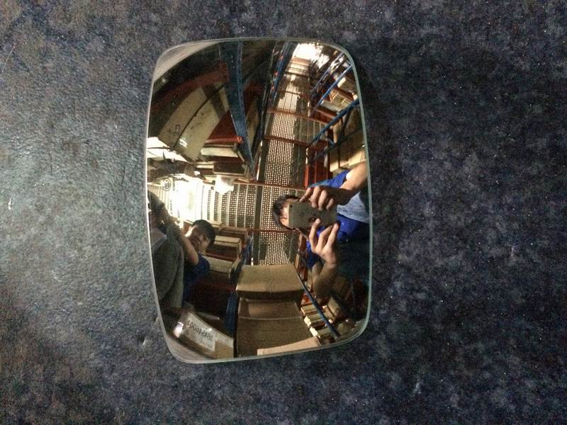 Blind spot lens under main mirror