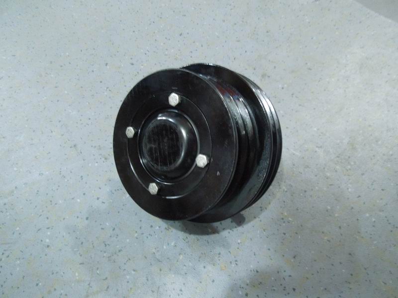 Air conditioner tensioner assembly