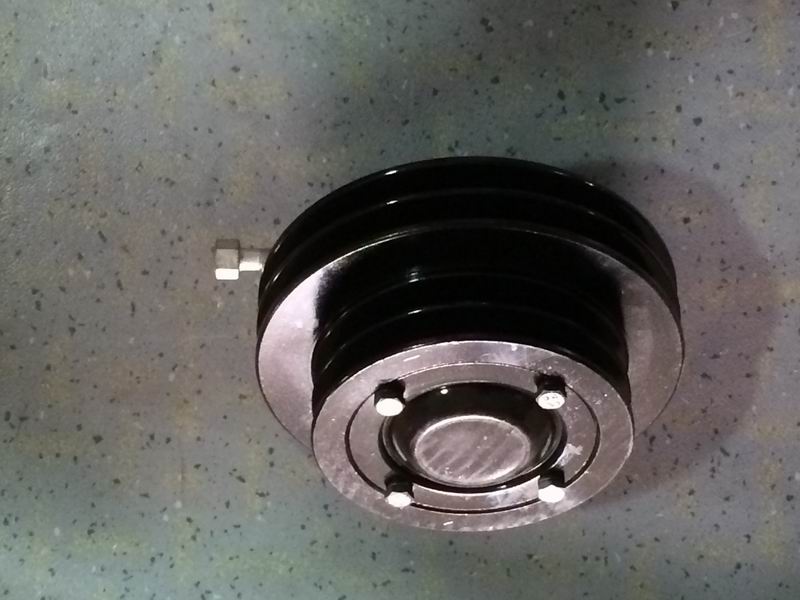 Air conditioner tensioner assembly